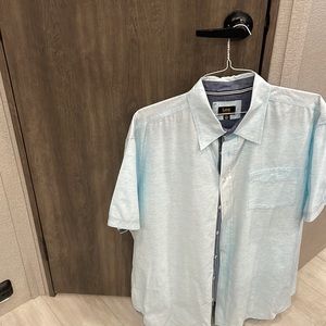A light blue textured man’s shirt, 2 XL.